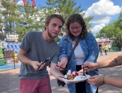 Spencer and Bailey eating funnel cake at Valley Fair
